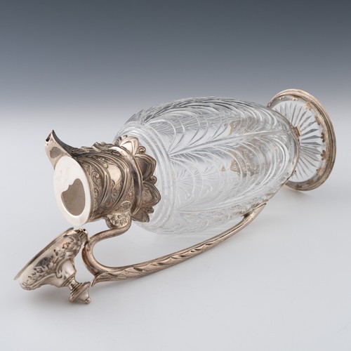 115 - A Victorian silver-mounted cut glass claret jug, the body with graduated, sloping festoon-type curvi... 