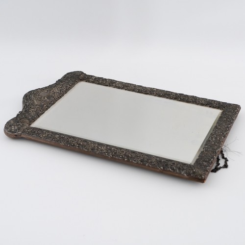 120 - A large Victorian silver easel dressing table mirror, with embossed, die-cut pierced front with scro... 