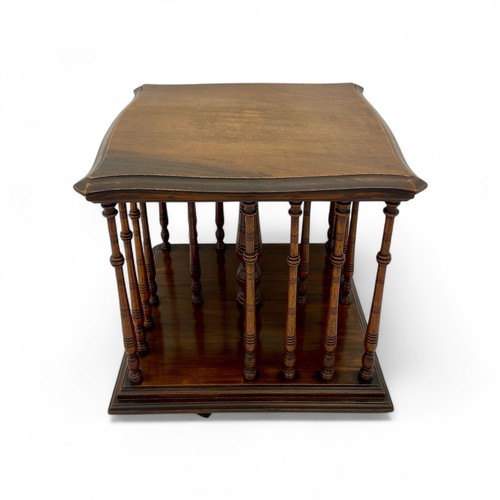 222 - A late Victorian or Edwardian mahogany table top revolving bookstand, with turned spindle supports, ... 