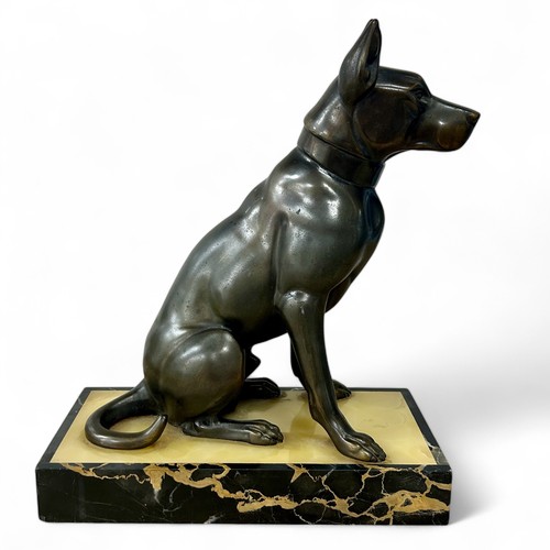 176 - A 1920s-30s French Art Deco patinated spelter sculpture of a dog, resembling bronze, on a yellowy-wh... 