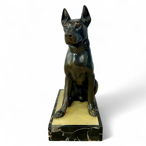 176 - A 1920s-30s French Art Deco patinated spelter sculpture of a dog, resembling bronze, on a yellowy-wh... 