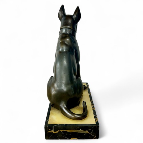 176 - A 1920s-30s French Art Deco patinated spelter sculpture of a dog, resembling bronze, on a yellowy-wh... 