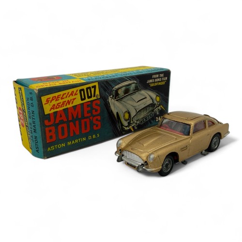 242 - A Corgi Toys No.261 'James Bond' Aston Martin DB5 model car, finished in gold, with wire wheels, red... 