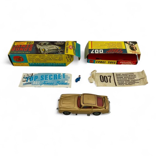 242 - A Corgi Toys No.261 'James Bond' Aston Martin DB5 model car, finished in gold, with wire wheels, red... 