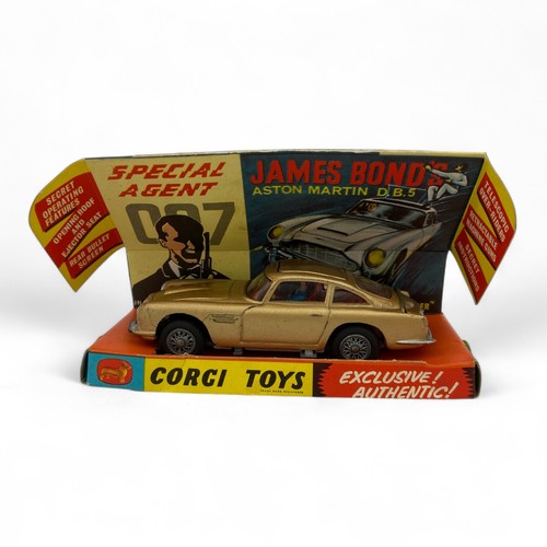 242 - A Corgi Toys No.261 'James Bond' Aston Martin DB5 model car, finished in gold, with wire wheels, red... 