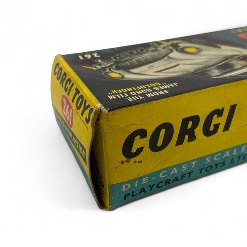 242 - A Corgi Toys No.261 'James Bond' Aston Martin DB5 model car, finished in gold, with wire wheels, red... 