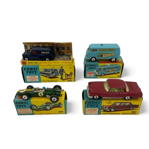 243 - A group of four Corgi Toys, comprising No.448 BMC Mini Police Van With Tracker Dog, with inner picto... 