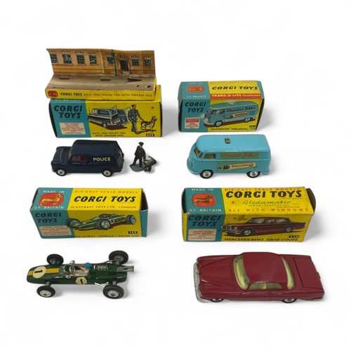 243 - A group of four Corgi Toys, comprising No.448 BMC Mini Police Van With Tracker Dog, with inner picto... 