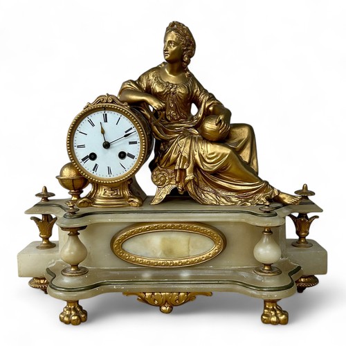 169 - A late 19thC Neoclassical style alabaster and gilt metal clock, with a reclining lady holding calipe... 