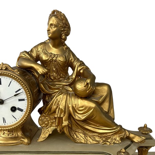 169 - A late 19thC Neoclassical style alabaster and gilt metal clock, with a reclining lady holding calipe... 