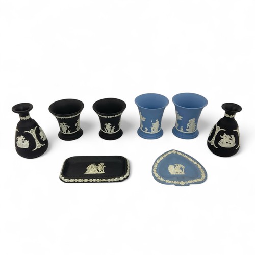 63 - A group of Wedgwood Jasperware small vases and dishes comprising a pair of small black tapered vases... 