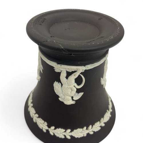 63 - A group of Wedgwood Jasperware small vases and dishes comprising a pair of small black tapered vases... 