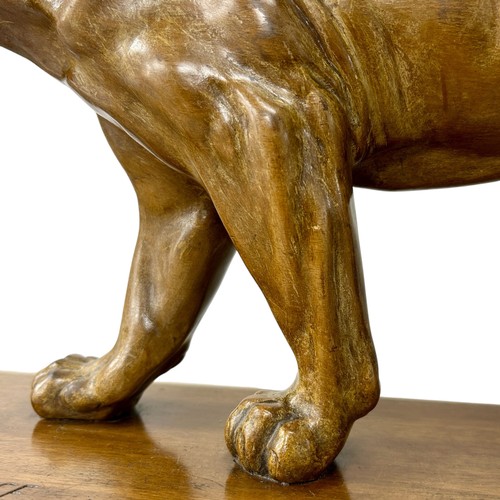 177 - A 1920s-30s French Art Deco carved wood sculpture of a prowling lioness embarking on a hunt, by an u... 