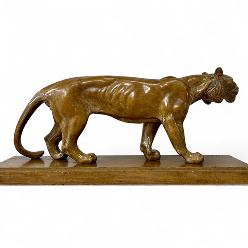 177 - A 1920s-30s French Art Deco carved wood sculpture of a prowling lioness embarking on a hunt, by an u... 