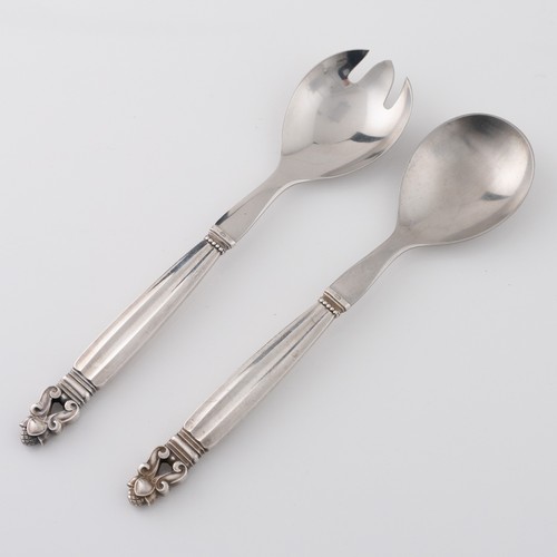 136 - A pair of mid-late 20thC Danish Georg Jensen 'Acorn' pattern white metal salad servers, designed in ... 