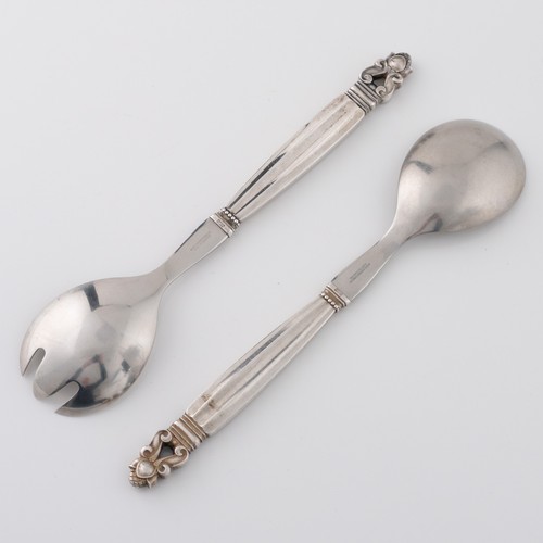 136 - A pair of mid-late 20thC Danish Georg Jensen 'Acorn' pattern white metal salad servers, designed in ... 