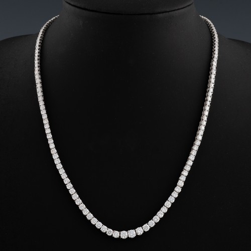 161 - An 18ct white gold graduated diamond Line or Tennis necklace, claw set with 155 graduated round bril...