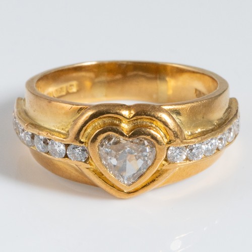 147 - An 18ct yellow gold heart-shaped diamond cluster ring, the heart-shaped diamond of approximately 0.6... 