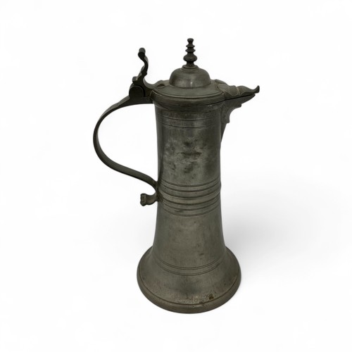 251 - A mid-late 20thC large 'Hohenloher' pewter lidded flagon in the style of August Weygang (1859-1946),... 