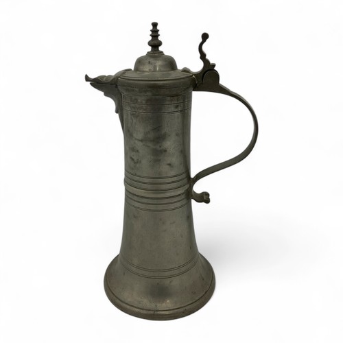 251 - A mid-late 20thC large 'Hohenloher' pewter lidded flagon in the style of August Weygang (1859-1946),... 