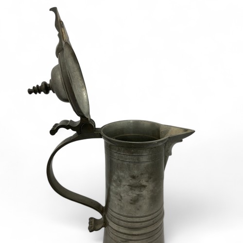 251 - A mid-late 20thC large 'Hohenloher' pewter lidded flagon in the style of August Weygang (1859-1946),... 