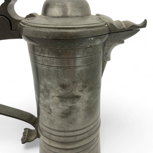 251 - A mid-late 20thC large 'Hohenloher' pewter lidded flagon in the style of August Weygang (1859-1946),... 