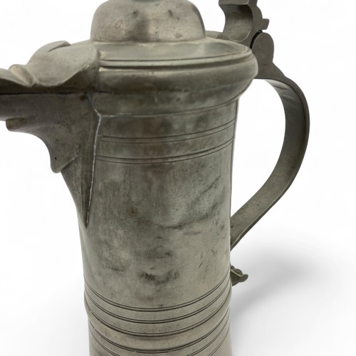 251 - A mid-late 20thC large 'Hohenloher' pewter lidded flagon in the style of August Weygang (1859-1946),... 