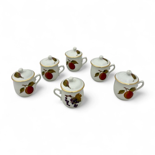 18 - A late 20thC Royal Worcester boxed set of six transfer-printed 'Evesham' pattern lidded coffee cups,... 