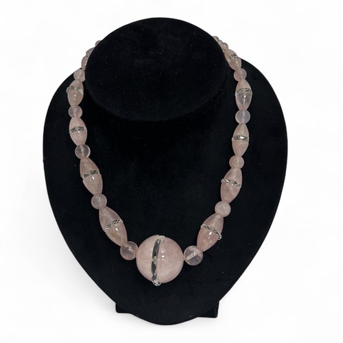 170 - A 1930-40s Art Deco pink quartz and carved rock crystal necklace, graduated set of round and ovoid p... 