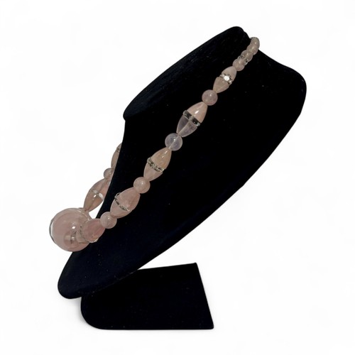 170 - A 1930-40s Art Deco pink quartz and carved rock crystal necklace, graduated set of round and ovoid p... 