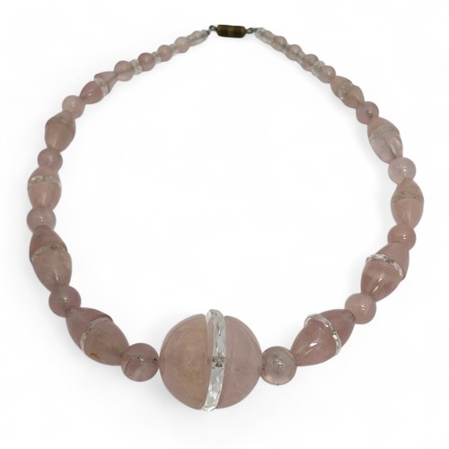 170 - A 1930-40s Art Deco pink quartz and carved rock crystal necklace, graduated set of round and ovoid p... 