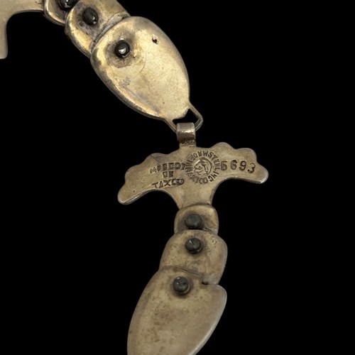 175 - A 1950s Margot de Taxco (Margot Van Voorhies Carr) enamelled white metal bracelet and brooch, articu... 