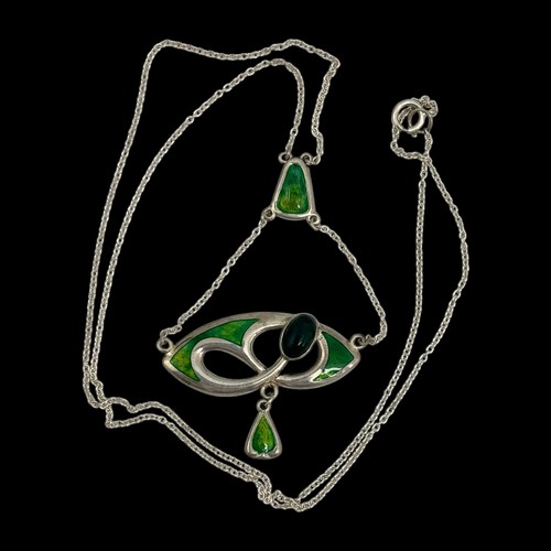 143 - A Charles Horner silver and enamel pendant, decorated with an openwork design set with  a dark green... 