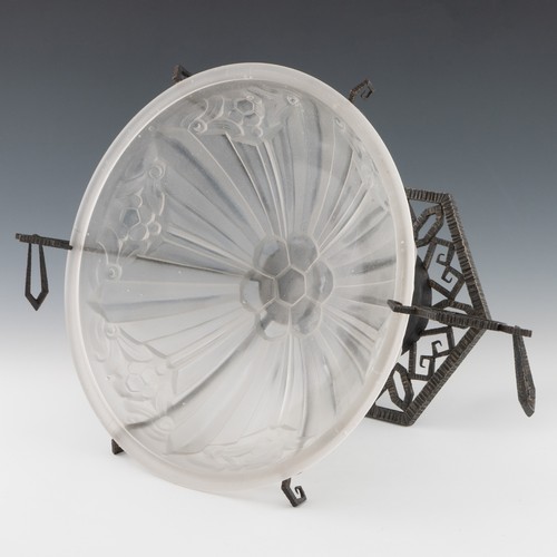 77 - A 1920s Art Deco glass and cast iron table centrepiece, clear and frosted moulded glass body with sa... 