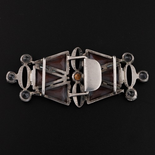 152 - A 1920s Art Deco Saphiret buckle, decorated with triangular Saphirets mounted on a white metal frame... 