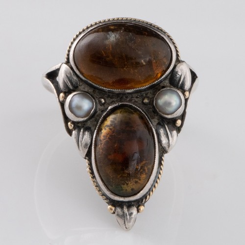118 - An early 20thC Arts and Crafts citrine and pearl ring, decorated with two large oval citrine cabocho... 