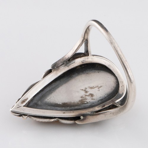 118 - An early 20thC Arts and Crafts citrine and pearl ring, decorated with two large oval citrine cabocho... 