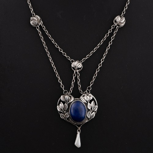 113 - An early 20thC English Arts and Crafts lapis lazuli pendant necklace, heart-shaped decorated with sp... 