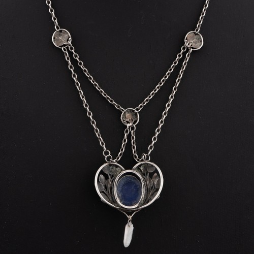 113 - An early 20thC English Arts and Crafts lapis lazuli pendant necklace, heart-shaped decorated with sp... 