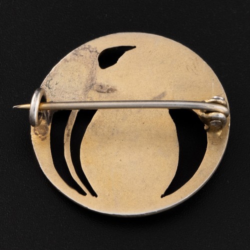 140 - An early 20thC Art Nouveau white metal and chrysoprase brooch, decorated with gilded semi-openwork d... 