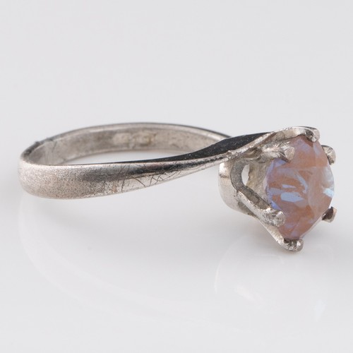 153 - A 1930s Saphiret white metal crossover ring, decorated with Saphiret exhibiting excellent colour cha... 
