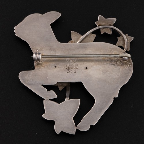 180 - A Georg Jensen sterling silver brooch designed by Arno Malinowski, c.1950, brooch depicts a gambling... 