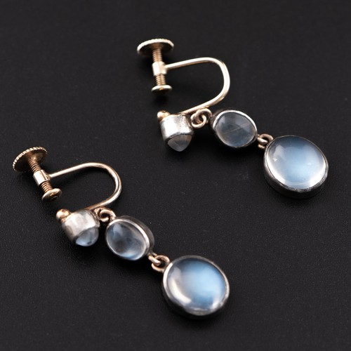 176 - A mid-20thC style pair of yellow and white metal earrings with moonstones, the back with screw threa... 