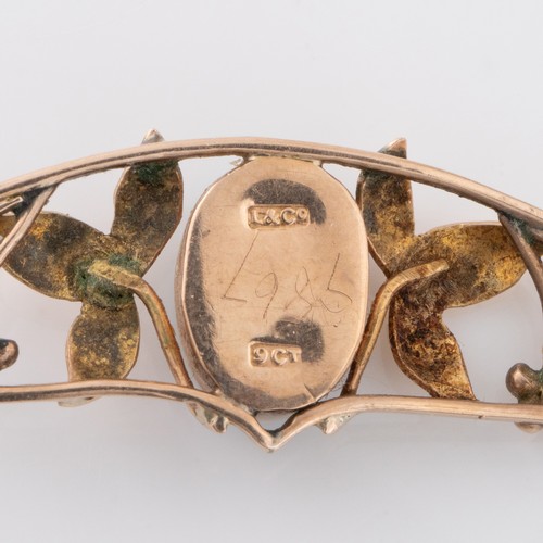 129 - A Liberty of London 9ct gold and turquoise brooch, with openwork frame depicting leaves and berries ... 