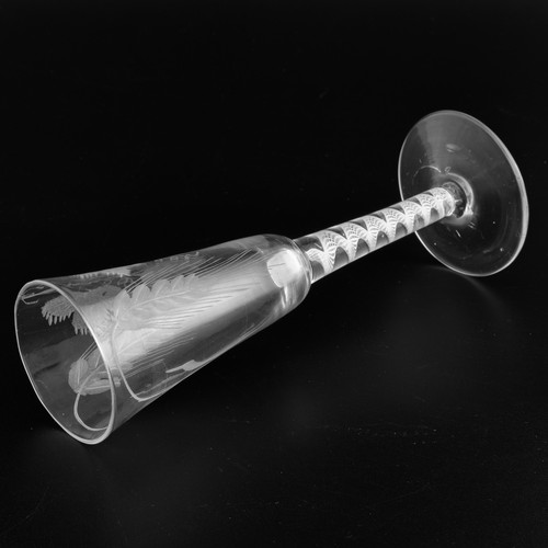 A Georgian ale glass with an opaque twist stem, the round funnelled ...