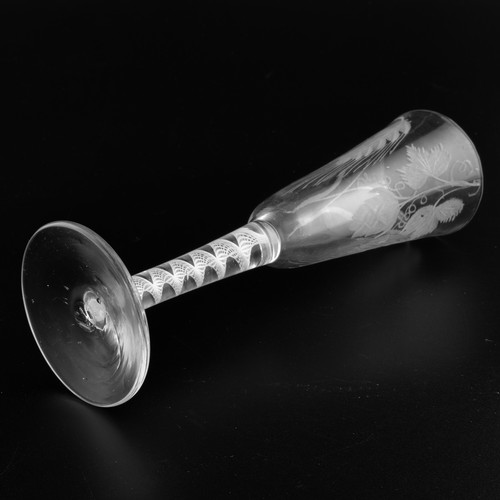 A Georgian ale glass with an opaque twist stem, the round funnelled ...