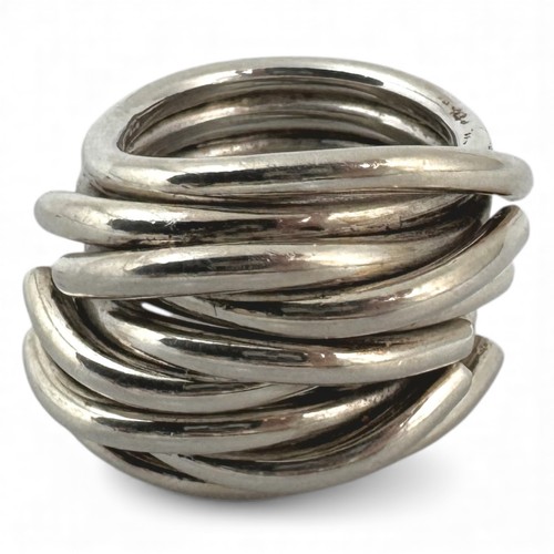 A 1970s white metal ring, modelled as six loops of silver wire and ...
