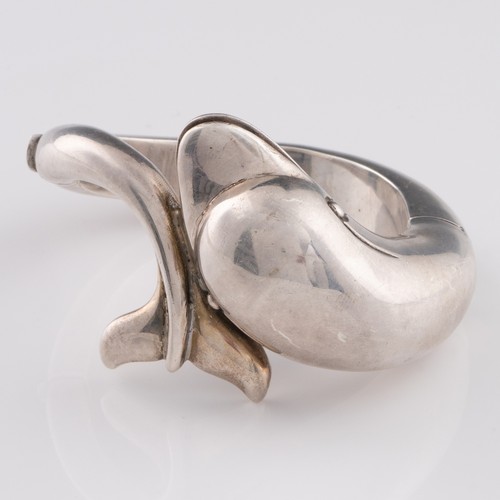 A late 20thC or early 21stC heavy white metal bangle in form of a ...