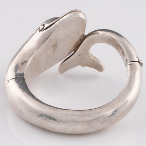 A late 20thC or early 21stC heavy white metal bangle in form of a ...