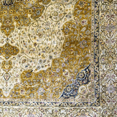 46 - 20th century Indian silk rug, central tiered floral medallion surrounded by botanical sprays and scr... 